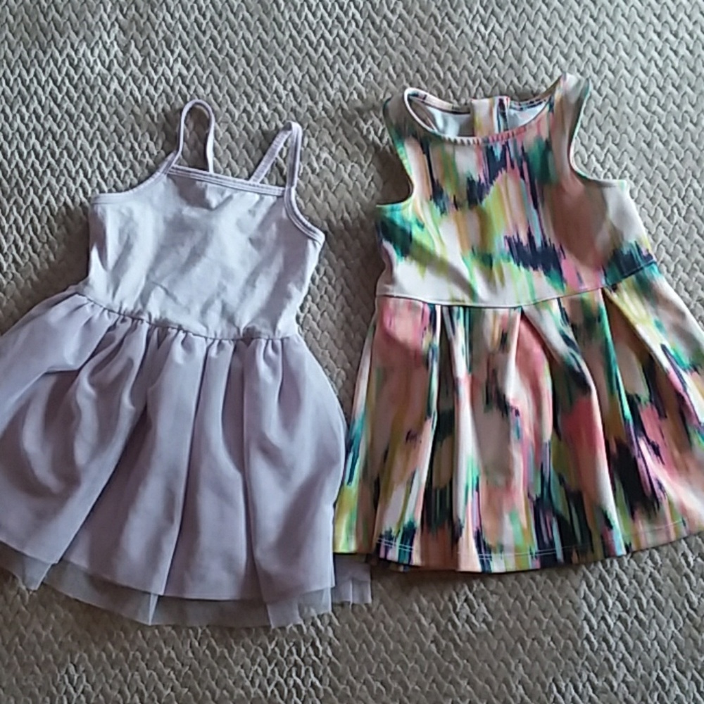 One purple dress and one multicolored dress